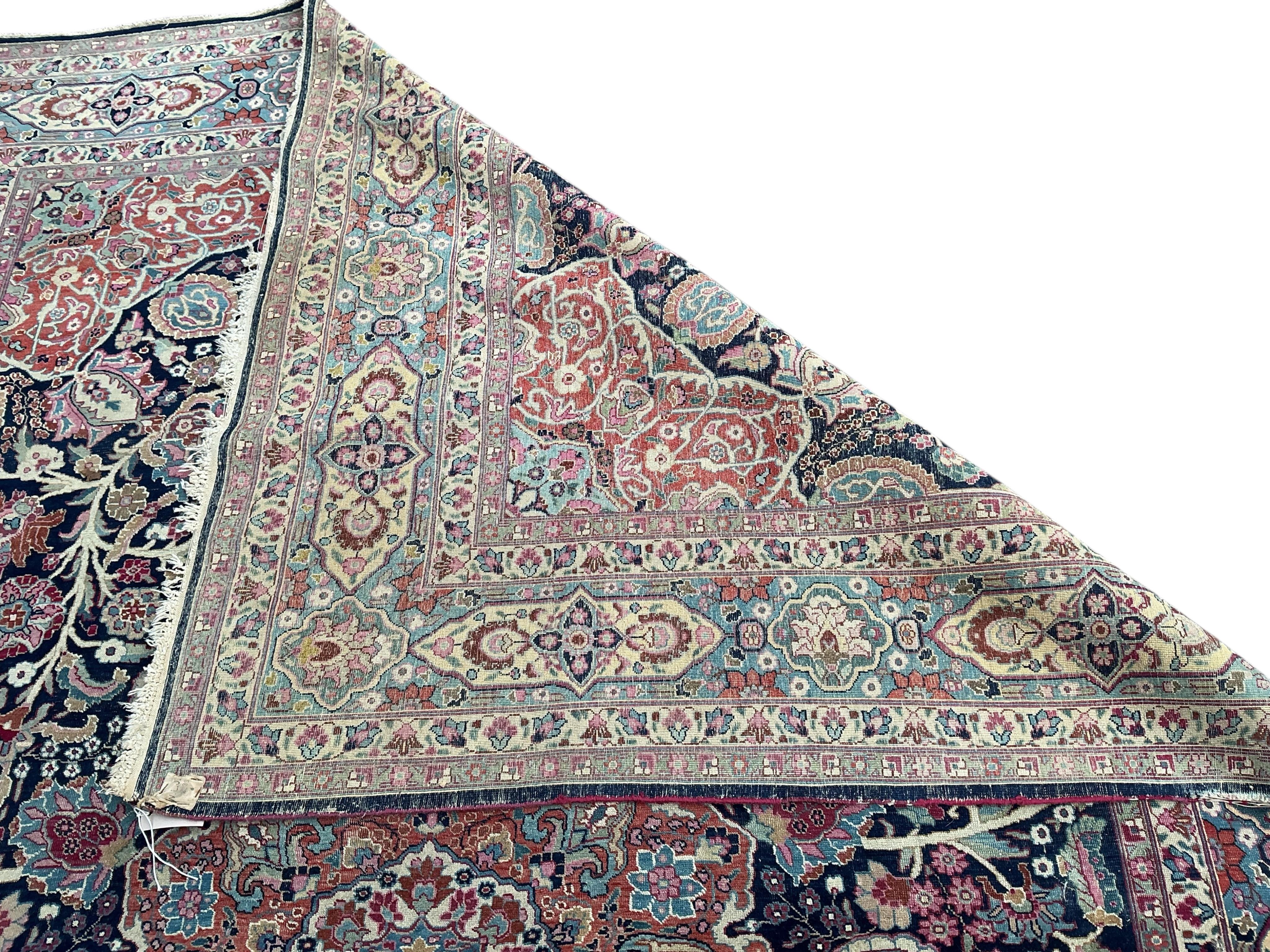 An early 20th century Kashan blue ground carpet, 315 x 206cm